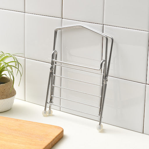 A stainless compost holder, showcasing a blend of functionality and aesthetics.