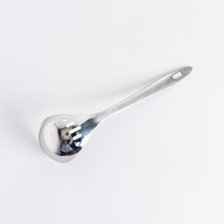 A stainless steel ladle with small drainage holes and a wide, deep scoop, designed for straining while serving.