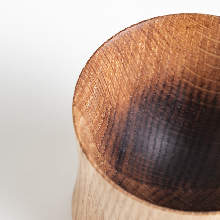 Close-up of the rim and inner side of an Artisan Mizunara Oak whisky cup, highlighting the beautiful natural grain and smooth finish.