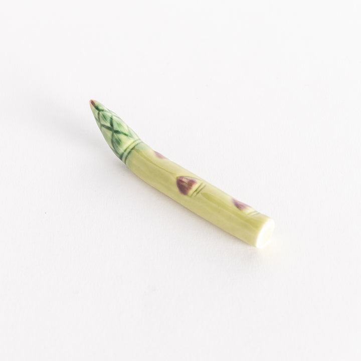 Slightly angled view of the asparagus chopsticks rest, emphasizing its realistic details.