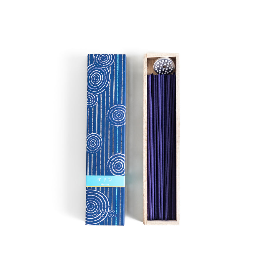 Azure Marine Incense in a light wooden box with deep blue sticks, elegantly packaged in a navy design featuring white circular patterns, evoking a refreshing and invigorating ocean breeze aroma.