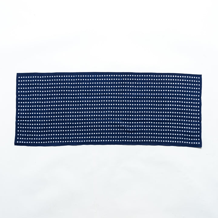 Navy tenugui fully laid out, featuring white bean dot patterns in rows.