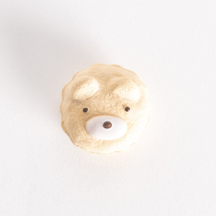 A top-down view of the bear cupcake ceramic chopstick rest, showcasing its circular shape and intricate details.