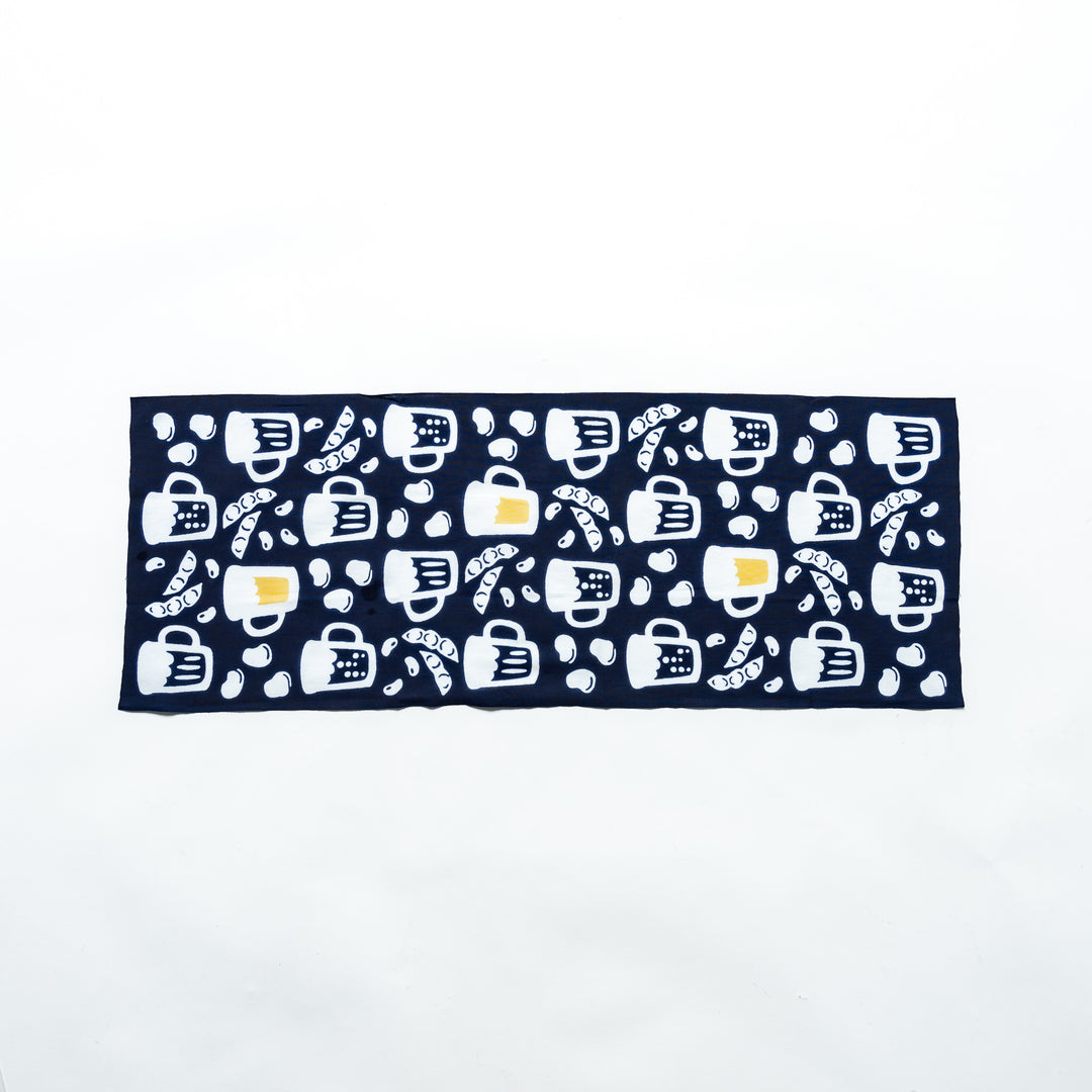 Fully extended dark navy tenugui showcasing beer mugs, soybeans, and edamame patterns in white and yellow.