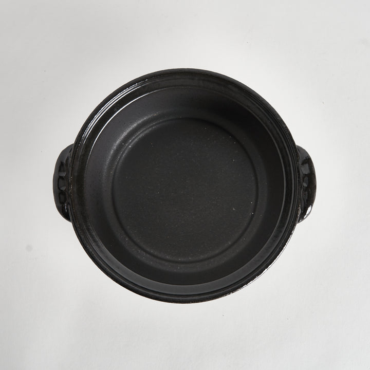 Black donabe interior without insert, viewed from the top, showing smooth black surface.