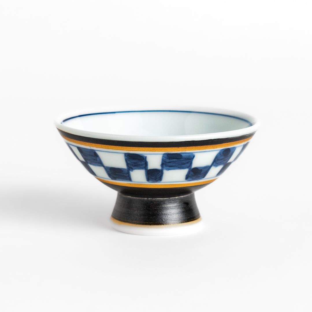 Elegant Japanese Sake Cup featuring a black and white checkered design, perfect for enjoying your favorite sake. 