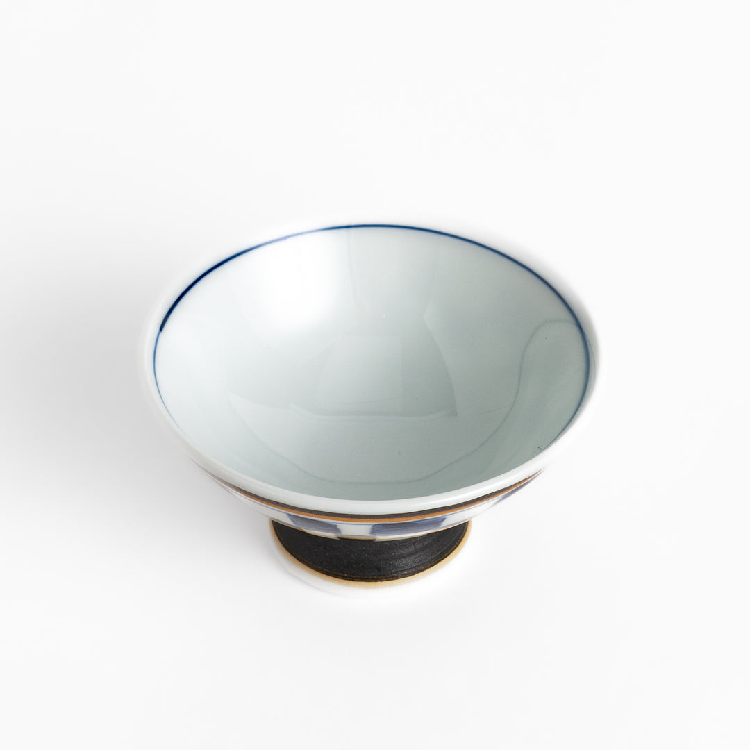 Elegant Japanese Sake Cup featuring a black and white checkered design, perfect for enjoying your favorite sake. 