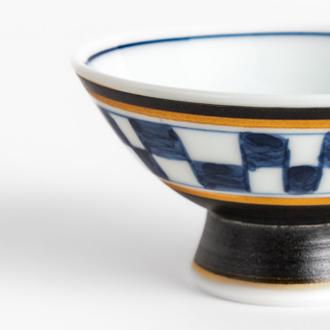 Elegant Japanese Sake Cup featuring a black and white checkered design, perfect for enjoying your favorite sake. 