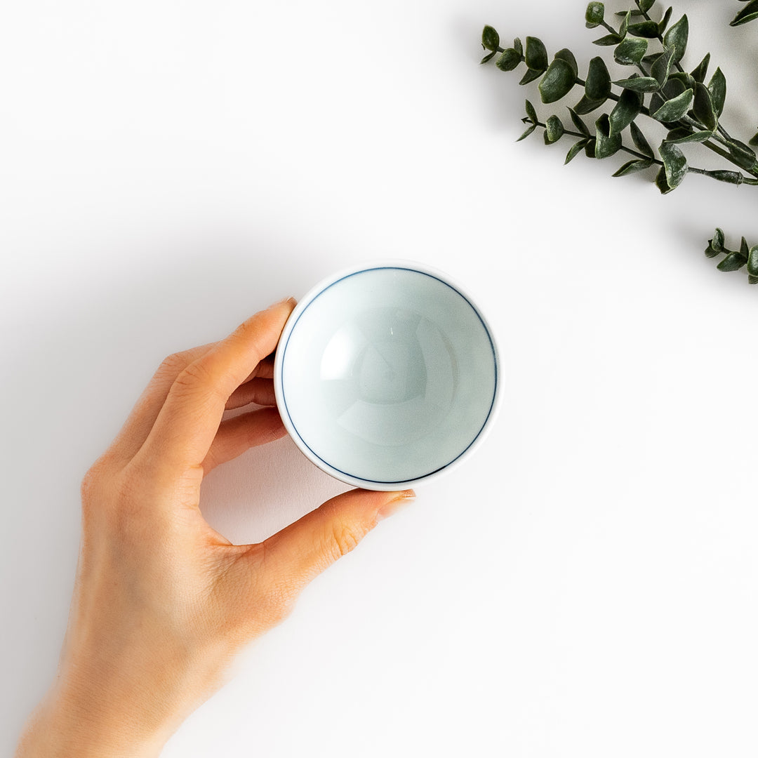 Elegant Japanese Sake Cup featuring a black and white checkered design, perfect for enjoying your favorite sake. 