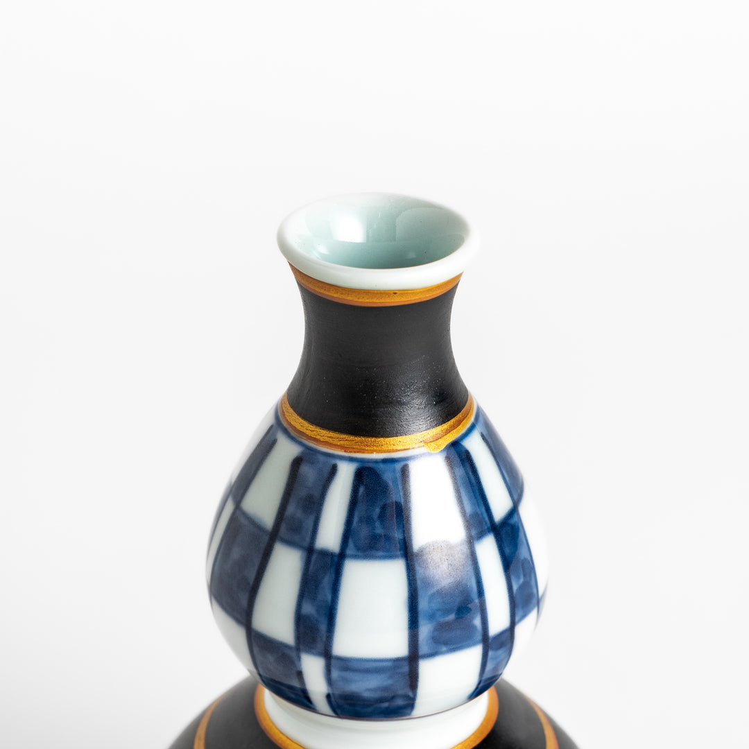 Elegant Japanese Sake Carafe featuring a black and white checkered design, perfect for serving your favorite sake.