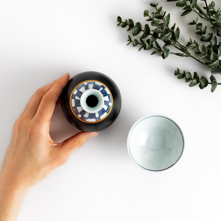 Elegant Japanese Sake Set featuring a black and white checkered design, perfect for enjoying your favorite sake.