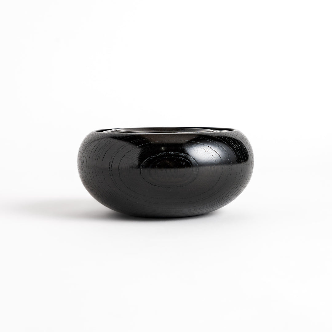 Black lacquered Oryoki bowl set featuring a large serving bowl, three medium bowls, and three small plates with a glossy finish.