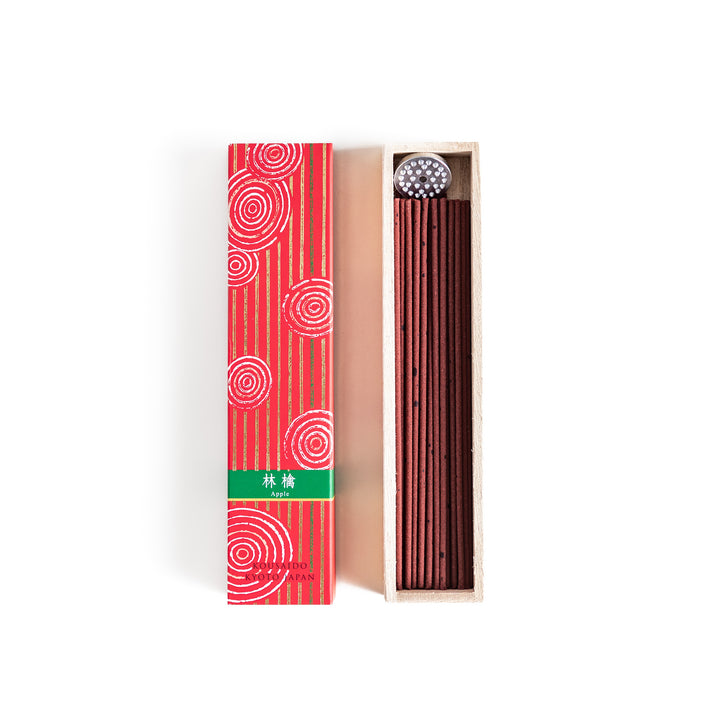 Blissful Apple Incense in a light wooden box with rich red sticks, elegantly packaged in a vibrant red design featuring white circular patterns, evoking a sweet and refreshing apple aroma.