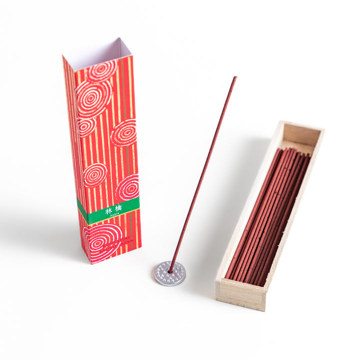 Blissful Apple Incense in a light wooden box with rich red sticks, elegantly packaged in a vibrant red design featuring white circular patterns, evoking a sweet and refreshing apple aroma.