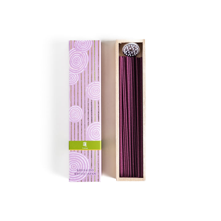 Incense in a light wooden box with rich purple sticks, presented in elegant packaging featuring white circular patterns on a soft lavender background for a serene ambiance.