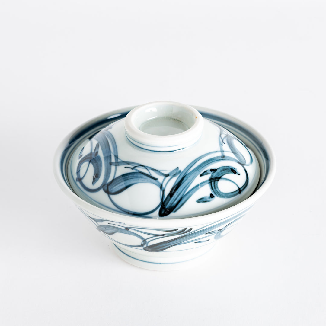 Side view of the blue arabesque donburi bowl, displaying its unique form and artistic patterns.