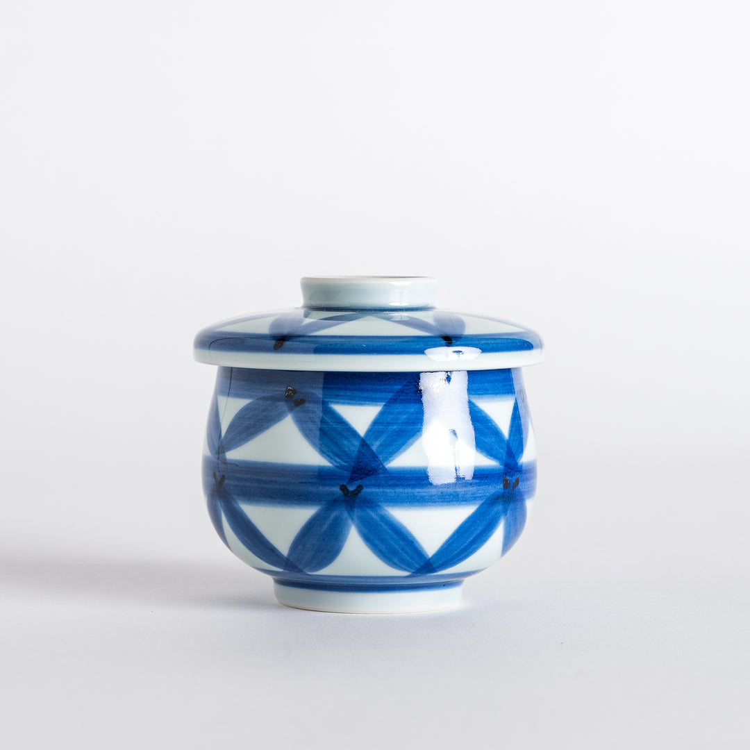 Side view of the Chawanmushi Bowl with its lid, capturing the artistic blue pattern and shape.