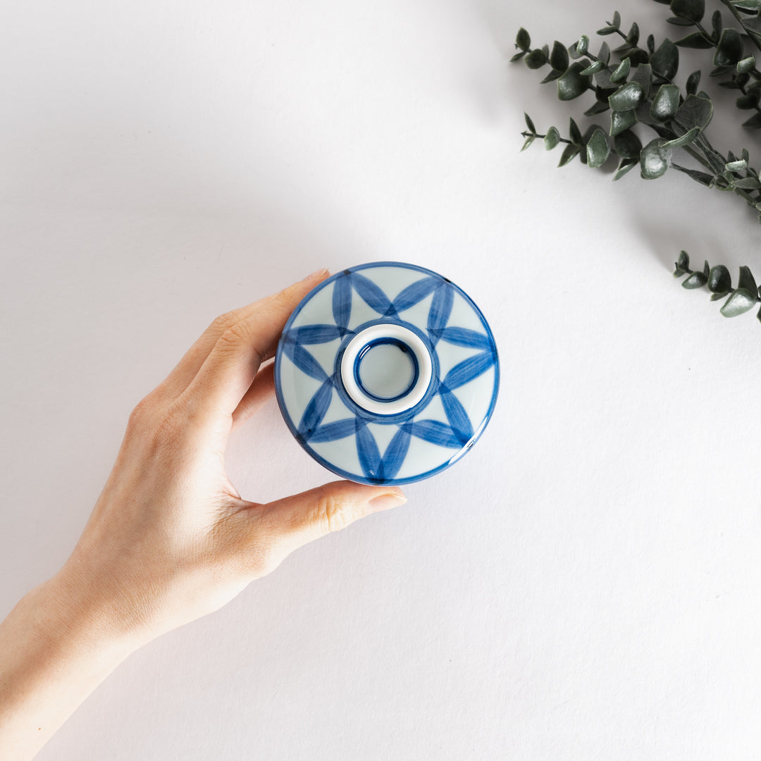 Top view of the Chawanmushi Bowl held in a hand, emphasizing the intricate blue pattern and details.