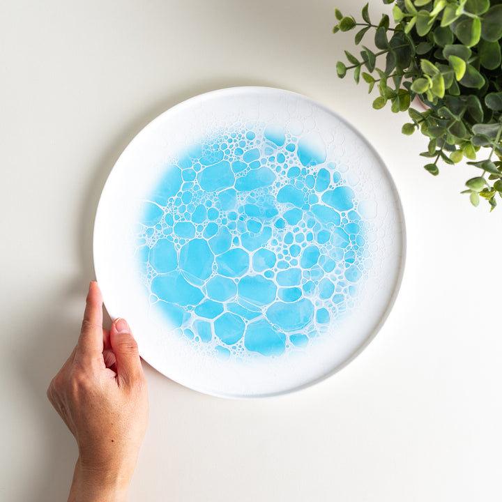 Top-down view of the Bubble Dinner Plate held in hand, illustrating the size and details of the bubble design.