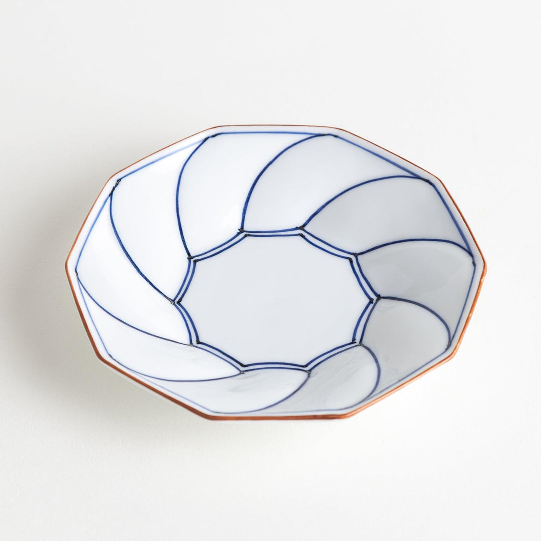 Octagonal dessert plate with a petal design and bowl shape, outlined in blue and red with a brown rim.