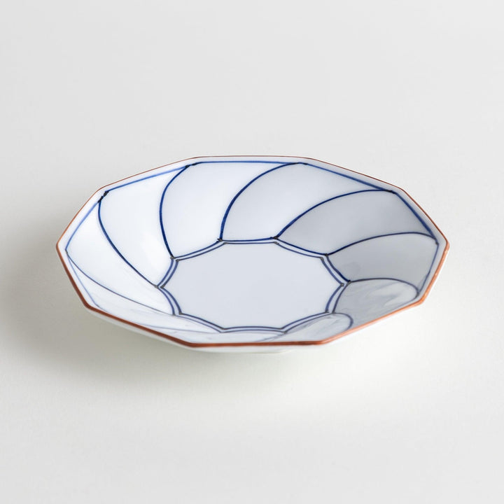 Octagonal dessert plate with a petal design and bowl shape, outlined in blue and red with a brown rim.