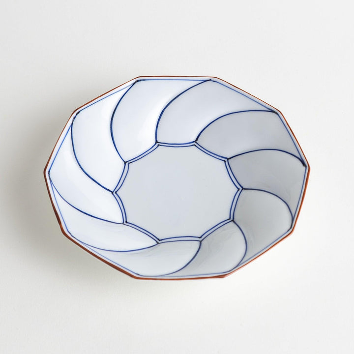 Medium-sized octagonal salad plate with a petal design and bowl shape, outlined in blue and red with a brown rim.