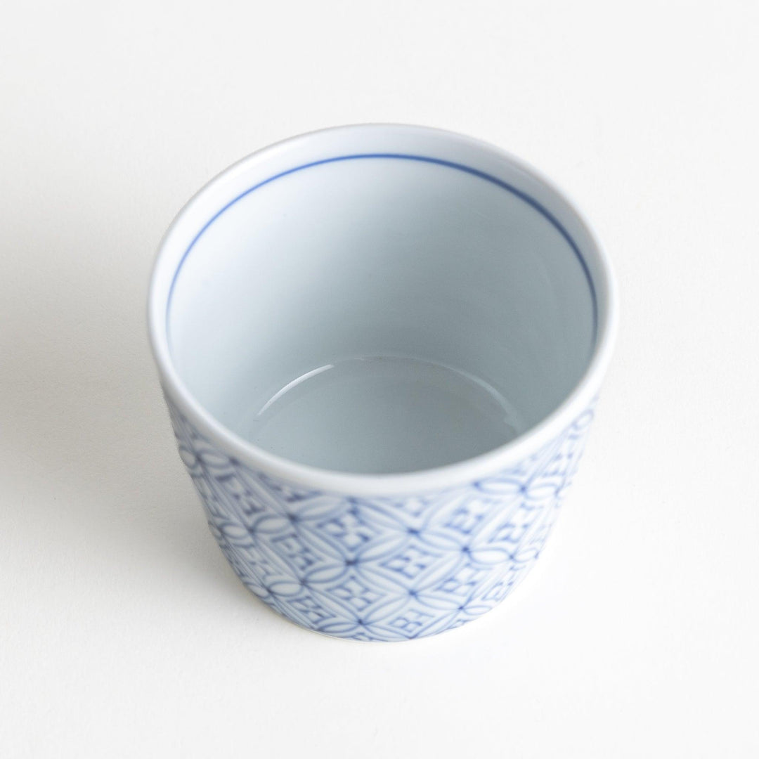 A small condiment bowl adorned with a blue or red geometric lattice pattern, providing a classic and intricate look.