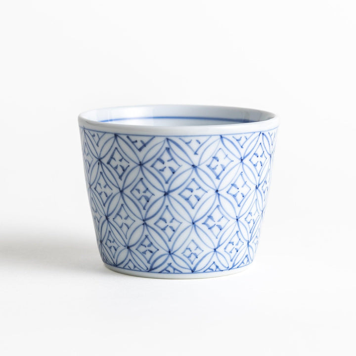 A small condiment bowl adorned with a blue or red geometric lattice pattern, providing a classic and intricate look.