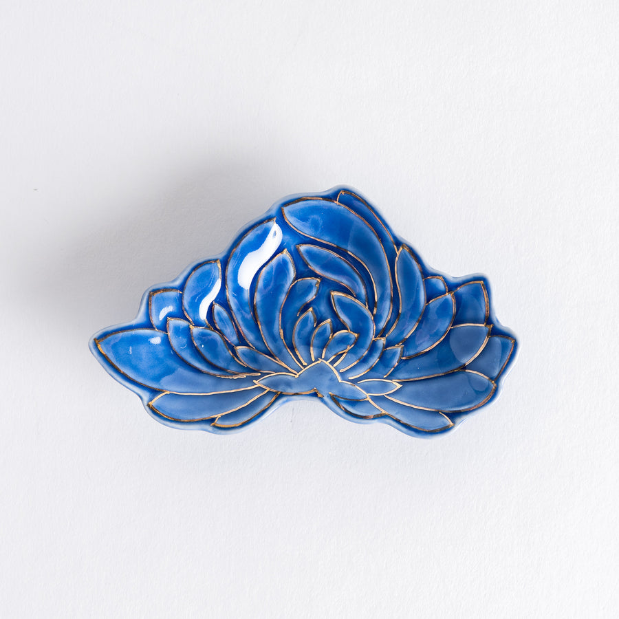 Blue chrysanthemum-shaped mini sauce dish with gold accents, showcasing intricate petal detailing and a glossy finish.