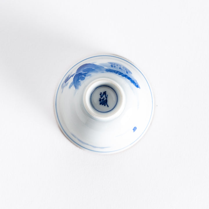 Bottom view of the sake cup, displaying the smooth porcelain base with subtle finishing details.