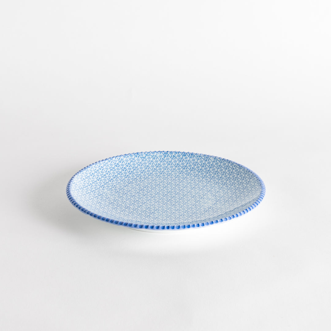 A side view of the blue sesame plate, featuring a detailed blue sesame pattern along the edges. The plate has a smooth, clean surface.