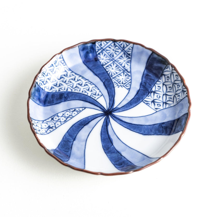 A small round plate featuring a blue swirl design with Mount Fuji background.