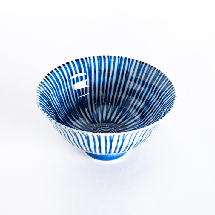 Slightly angled view of the blue-striped flared rice bowl, highlighting its elegant curves and striped pattern.