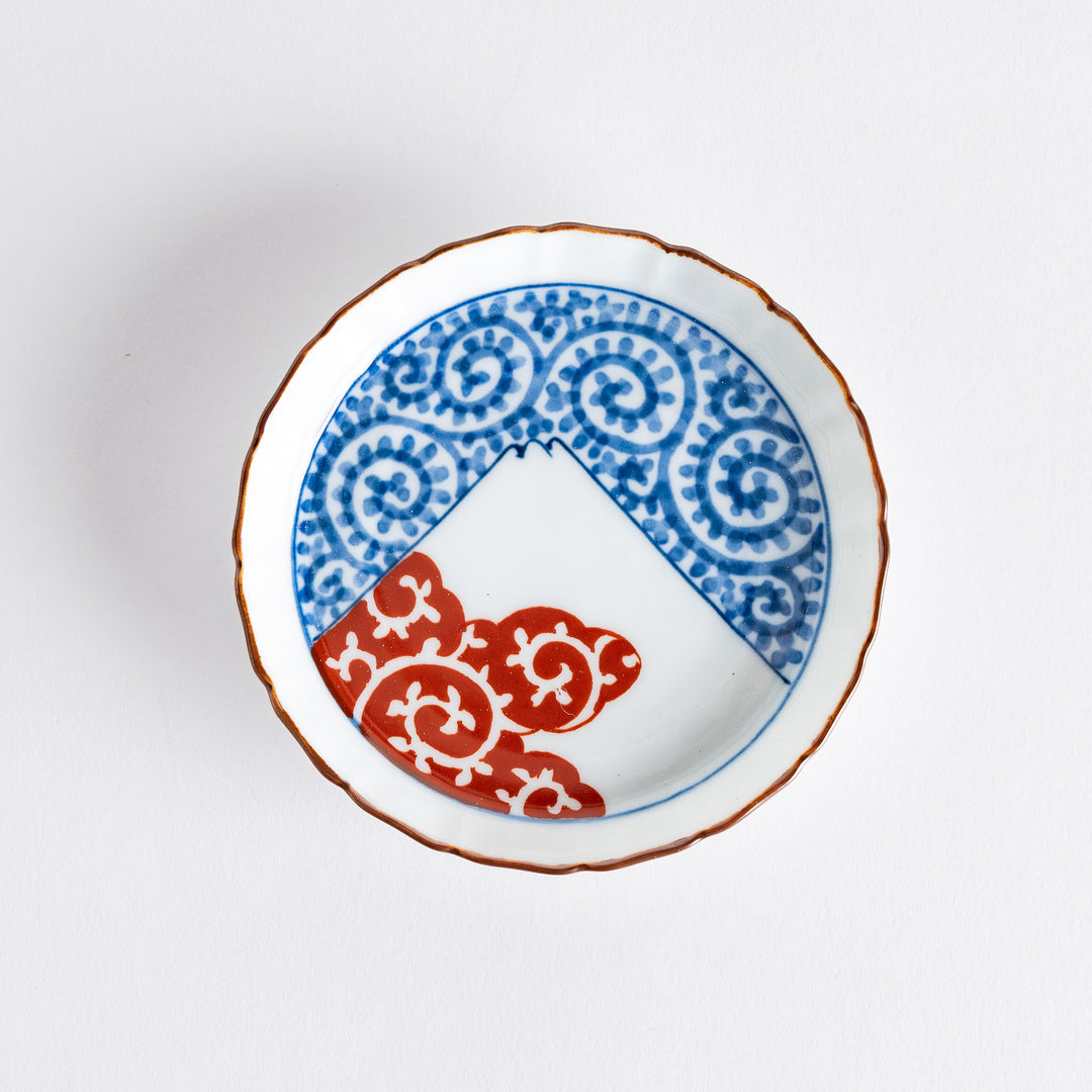 Blue spiral patterns and red cloud swirls decorate this raised rim sauce dish, with Mount Fuji at the center, blending elegance and tradition.