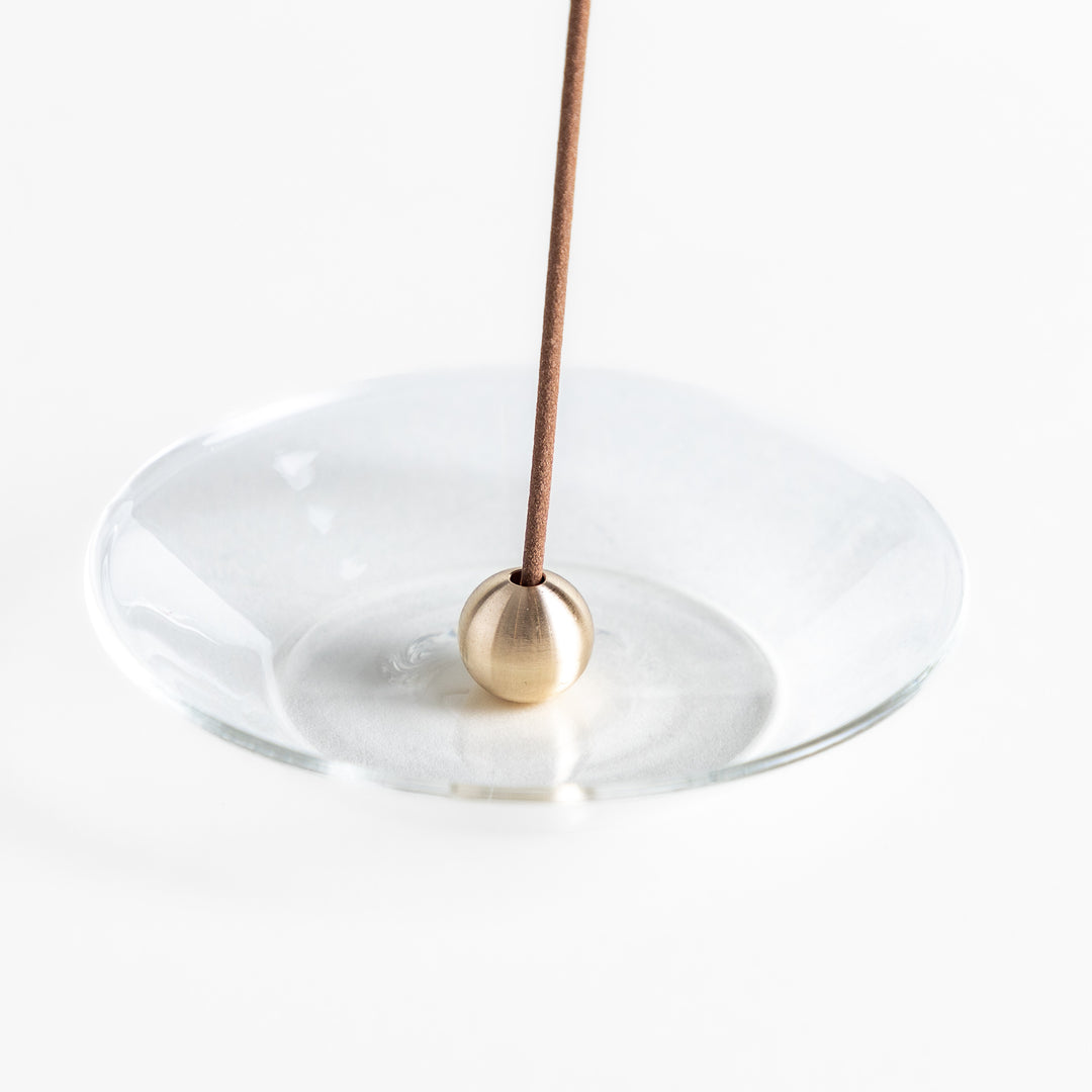 Modern glass Incense Holder with brass accent, a stylish way to enjoy your favorite scents.