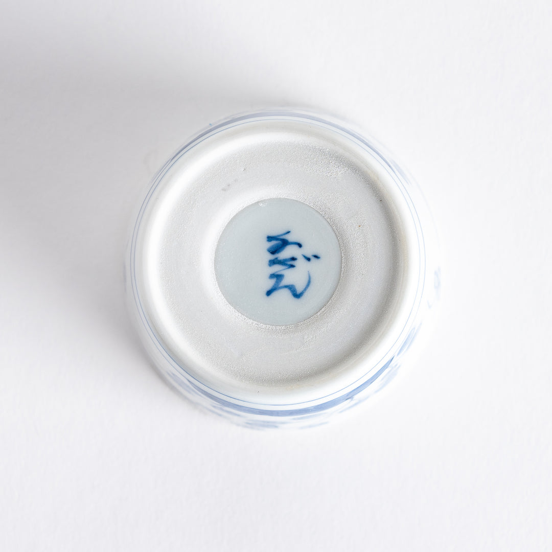 A white condiment bowl decorated with blue bush clover patterns around the side, ideal for small servings or sauces.