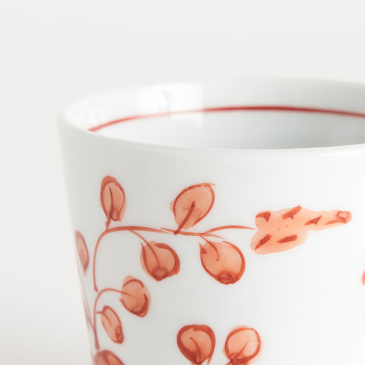 A white condiment bowl decorated with blue bush clover patterns around the side, ideal for small servings or sauces.