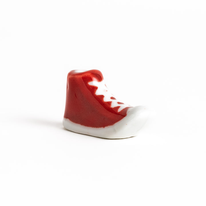 Red Canvas Sneaker Chopstick Rest with white laces and a detailed high-top design, adding a playful touch to your table setting.