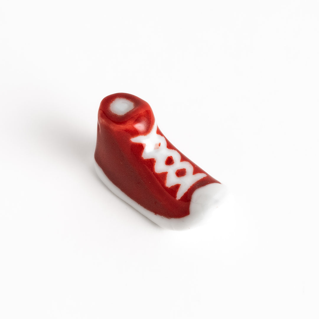 Red Canvas Sneaker Chopstick Rest with white laces and a detailed high-top design, adding a playful touch to your table setting.