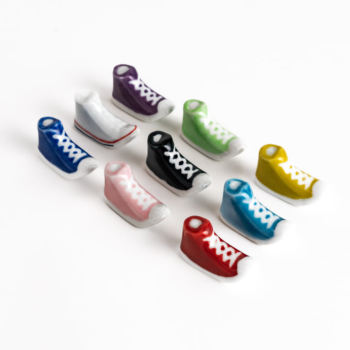 Colorful Sneaker Chopstick Rest Set displayed in rows, showcasing individual high-top sneaker designs in a variety of playful colors.