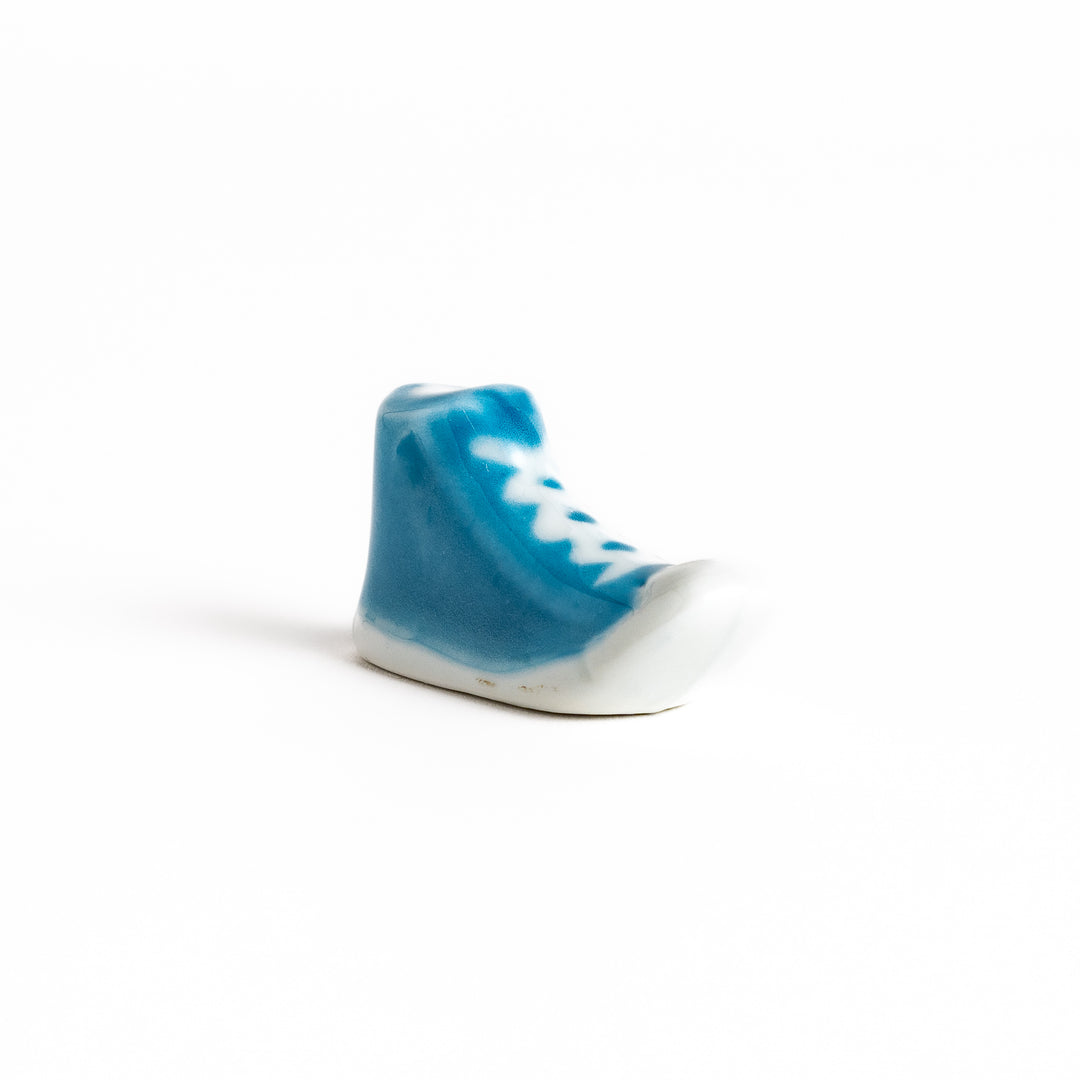 Light Blue Canvas Sneaker Chopstick Rest with white laces and a detailed high-top design, adding a playful touch to your table setting.