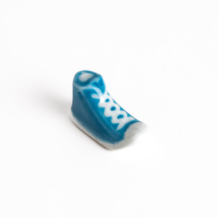 Light Blue Canvas Sneaker Chopstick Rest with white laces and a detailed high-top design, adding a playful touch to your table setting.