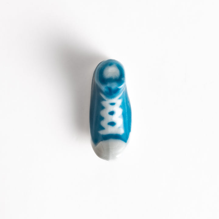 Light Blue Canvas Sneaker Chopstick Rest with white laces and a detailed high-top design, adding a playful touch to your table setting.