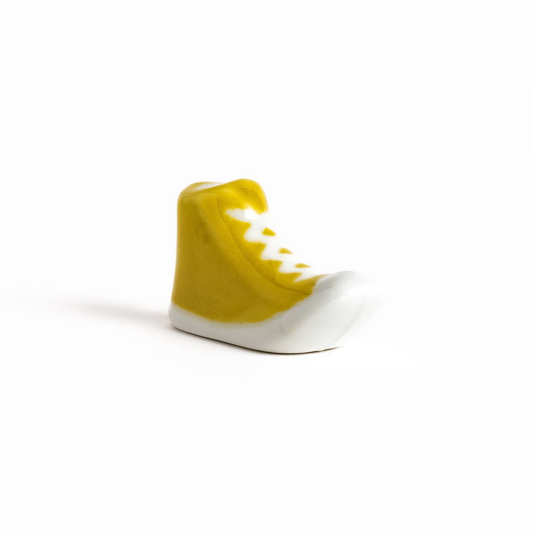 Yellow Canvas Sneaker Chopstick Rest with white laces and a detailed high-top design, adding a playful touch to your table setting.