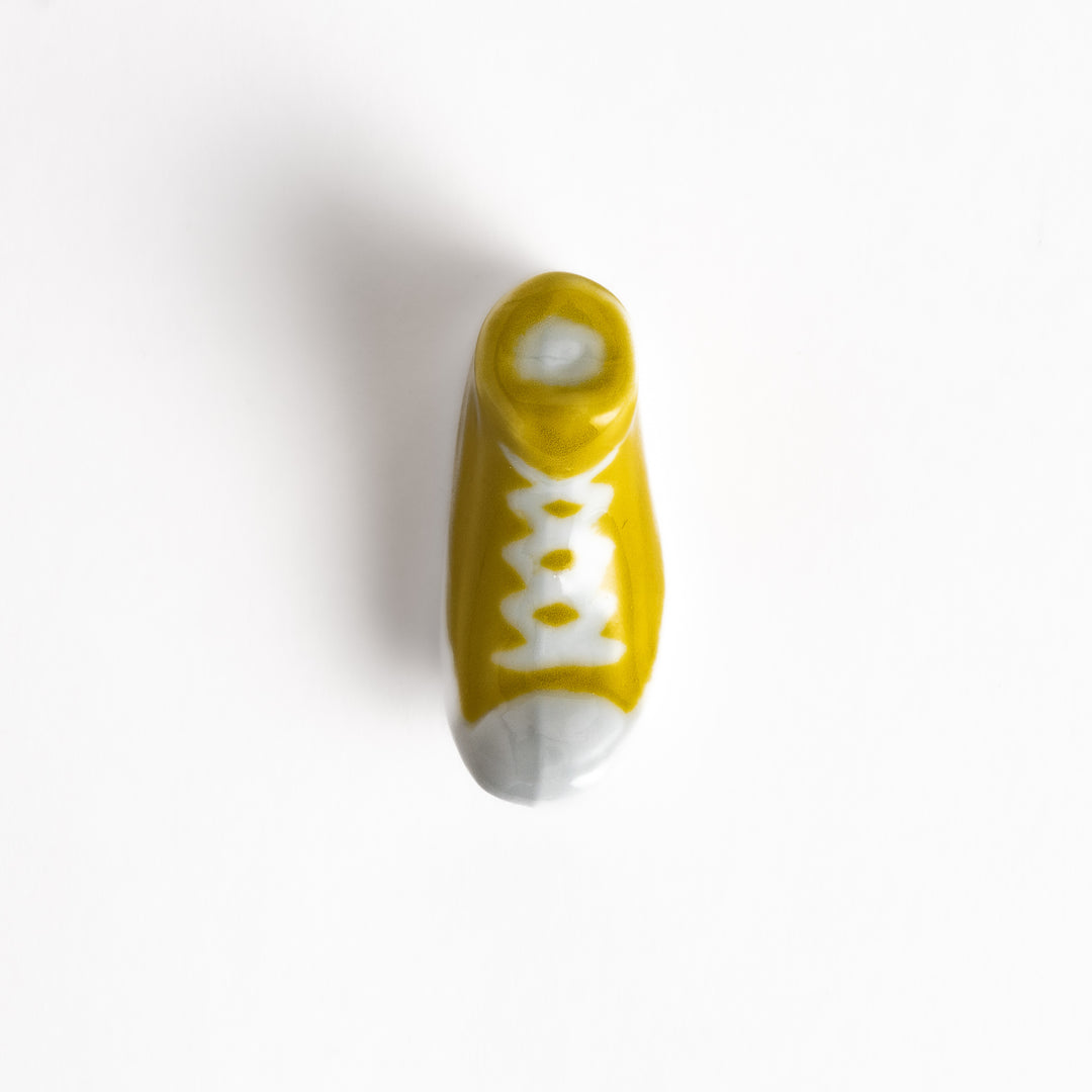 Yellow Canvas Sneaker Chopstick Rest with white laces and a detailed high-top design, adding a playful touch to your table setting.