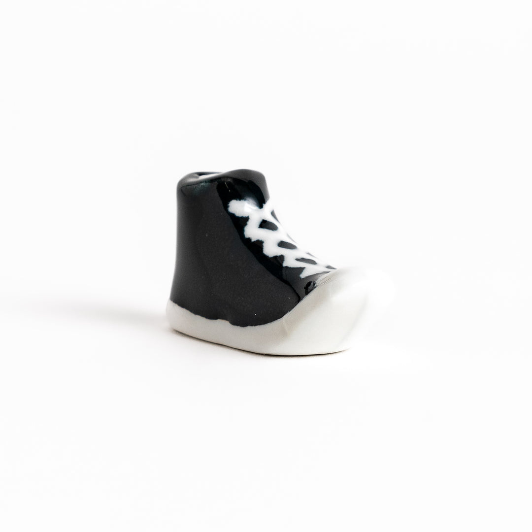 Black Canvas Sneaker Chopstick Rest with white laces and a detailed high-top design, adding a playful touch to your table setting.