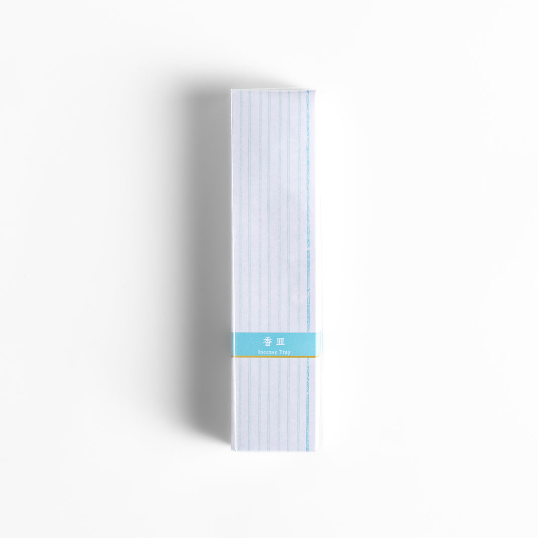 Incense Holder elegantly packaged in a minimalist white box with subtle vertical stripes and a light blue label, designed to complement a serene incense-burning experience.