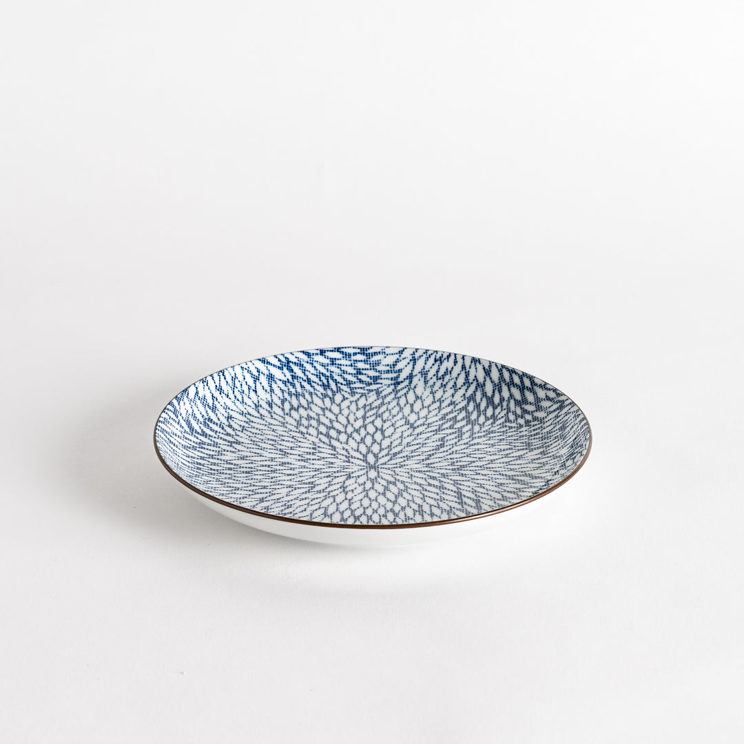 A salad plate with a detailed blue herringbone pattern radiating from the center.