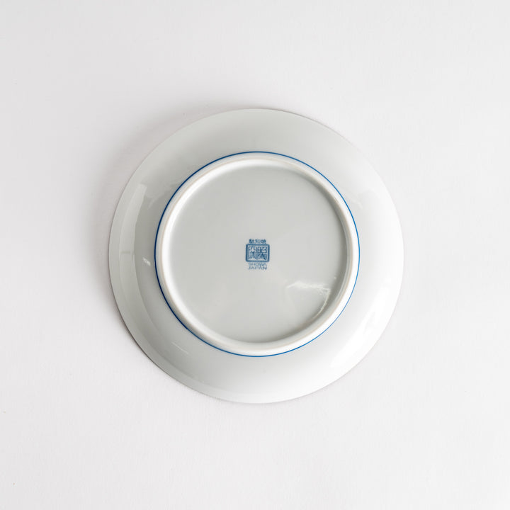 A salad plate with a detailed blue herringbone pattern radiating from the center.