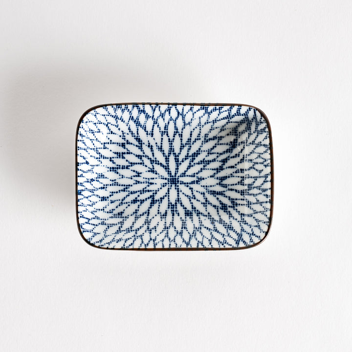 A small rectangular dish featuring a blue herringbone pattern on a white background.